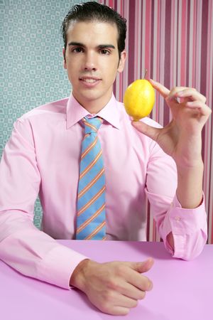 Funny businessman with lemon fruit on his hand in wallpaper backgroundの写真素材