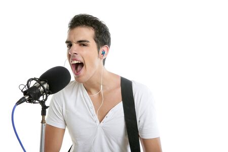 Musician young man playing electric guitar isolated on whiteの写真素材