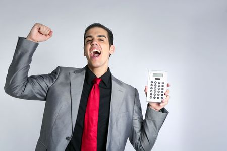 Calculator give good results to young businessman on gray backgroundの写真素材