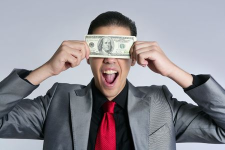 Businessman young with dollar notes suit and tie on gray backgroundの写真素材
