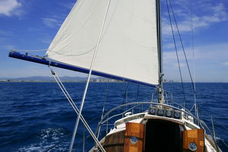 Sailboat sailing blue sea on sunny summer day in Mediterraneanの写真素材