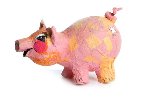 Cute little pink pig cartoon handmade toy isolated on whiteの写真素材