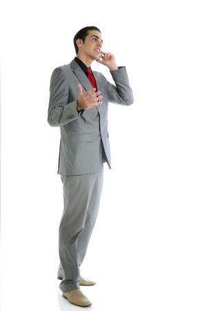 Businessman young full body talking phone isolated on whiteの写真素材