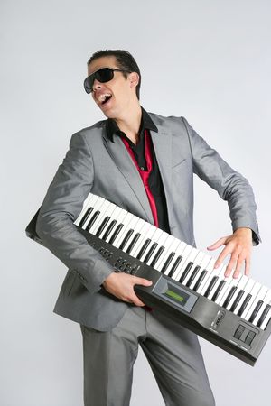 Businessman musician playing instrument with suit and tieの写真素材