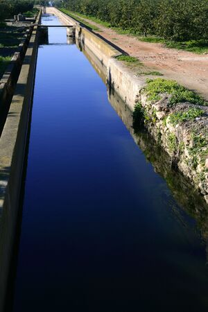 Ditch, arabic water channel for agriculture purpose in Spainの写真素材
