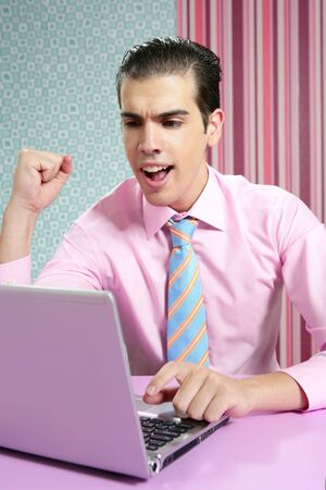 Happy successful young businessman in modern wallpaper officeの写真素材