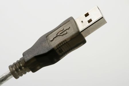 USB connection plug macro detail closeup over white backgroundの写真素材