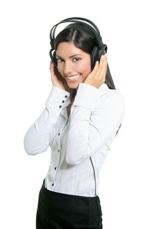 Beautiful brunette businesswoman hearing music on headphonesの写真素材