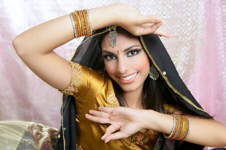 Beautiful indian brunette young woman with traditional fashionの写真素材