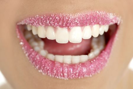 Lips of a woman in sugar pink liptstick makeup macroの写真素材
