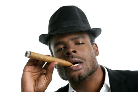 African american man smoking cigar portrait with black hatの写真素材