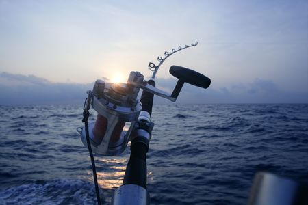 Big game boat fishing in deep sea on boatの写真素材