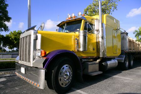 Big yellow american truck in sunny blue sky dayの写真素材