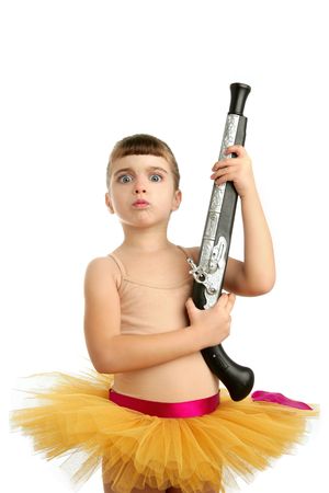 Beautiful little ballerina girl with blunderbuss weapon power and innocenceの写真素材