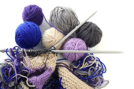 colorful knitting tools with wool thread balls