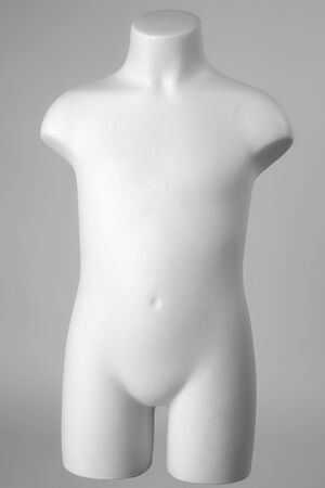 Mannequin of a child in white over gray backgroundの写真素材