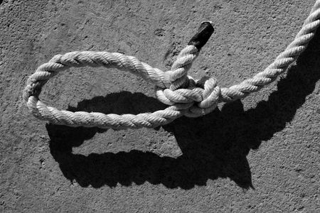 black and white bowline gauze on marine rope and shadowの写真素材