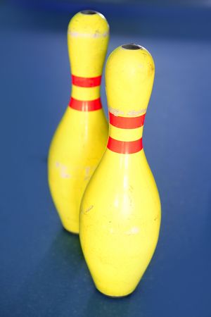 Bowling in yellow color still life blue background imageの写真素材