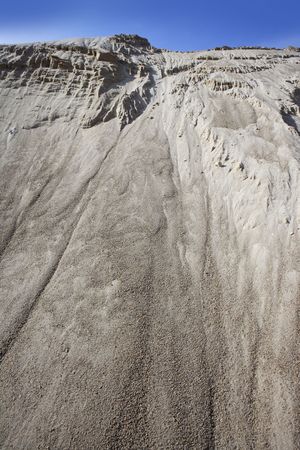 white sand quarry mound like moon mountain blue skyの写真素材