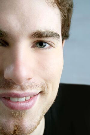smile closeup crop face young male portrait macroの写真素材