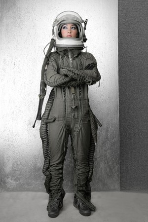 astronaut fashion woman full length space suit helmet silver studio backgroundの写真素材