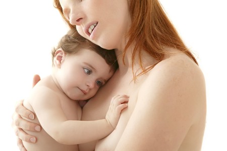 nude baby and mother portrait hug playing white backgroundの写真素材