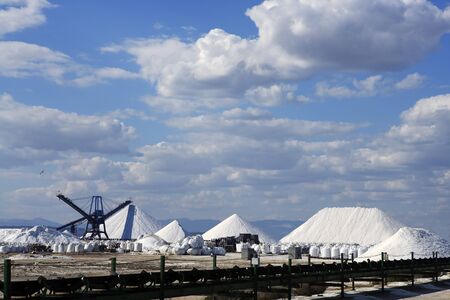 saltwoks with salt mountains from sea water in Mediterraneanの写真素材