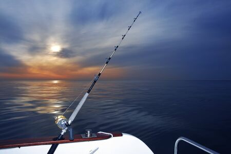 boat fishing sunrise on sea ocean rod and reels horizon