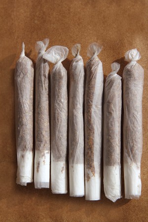 joint cigarettes hand rolled in row tobacco closeup