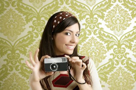 Retro photo camera shooting woman green sixties wallpaper vintage の写真素材