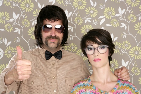 nerd silly couple tacky retro 60s man woman ok hand sign floral wallpaperの写真素材