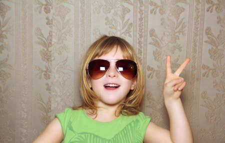 hand victory gesture little girl funny sunglasses retro wallpaper