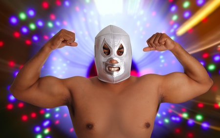 mexican wrestling mask silver fighter gesture night lights blurredの写真素材