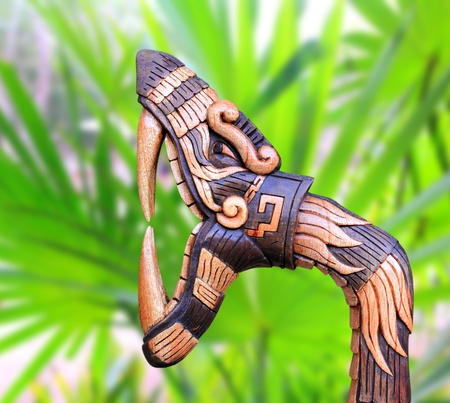 Chichen Itza Snake symbol wood handcraft figure in jungle Mexico Yucatanの写真素材