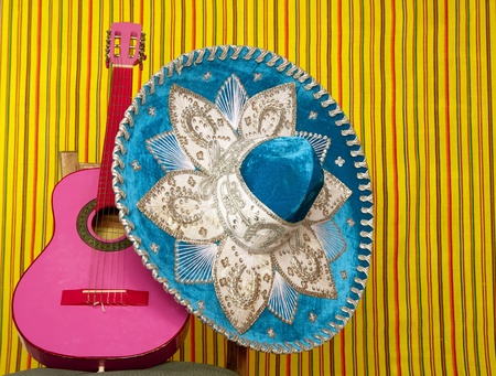 mariachi embroidery mexican hat pink guitar in striped backgroundの写真素材