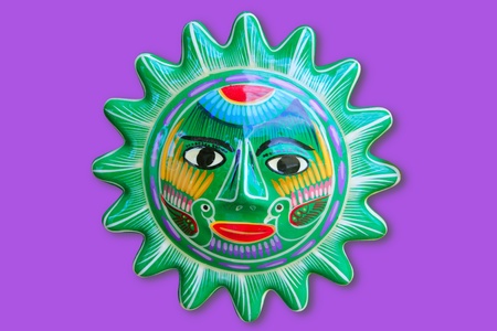 Mexican indian sun handcraft ceramic isolated in purple backgroundの写真素材