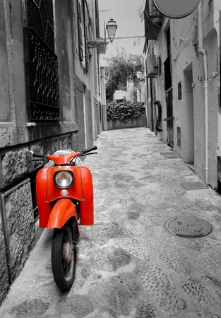 Mediterranean street with old retro red scooter in Palma de Mallorca Spainの写真素材