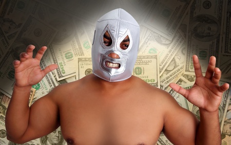 mexican wrestling mask silver fighter with aggresive gesture in dollar notes such a bet metaphorの写真素材