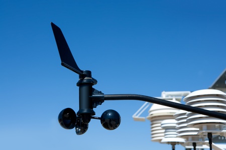 anemometer vane in weather station under blue skyの写真素材