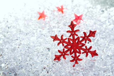 christmas red snowflake on winter ice backgroundの写真素材
