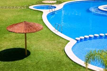 green garden with grass and swimming pool and sunroofの写真素材