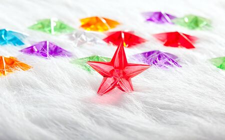 Christmas glass star over winter white fur background