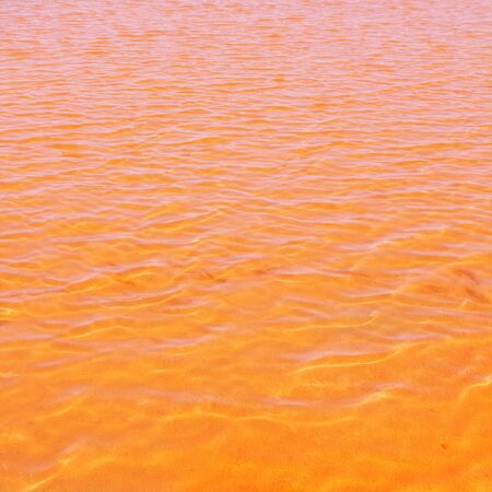 Formentera Ses Salines saltworks red orange water lakes with ripple wavesの写真素材