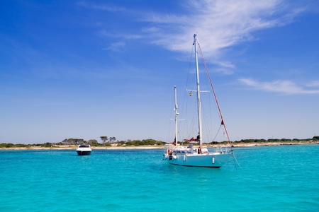 anchored sailboats in turquoise Formentera Illetes beach near Ibizaのeditorial素材