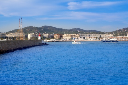 Ibiza Lighthouse and dock with boats in Mediterranean Spainの写真素材