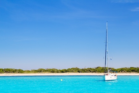 Luxury sailboat in turquoise beach of Formentera Illetesの写真素材