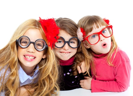 nerd children girl group with glasses and funny expressionの写真素材