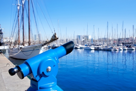Barcelona port marina with blue telescope and sailboatsの写真素材