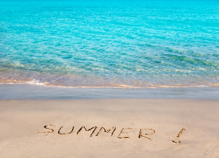 Caribbean tropical beach with Summer word written in sandの写真素材