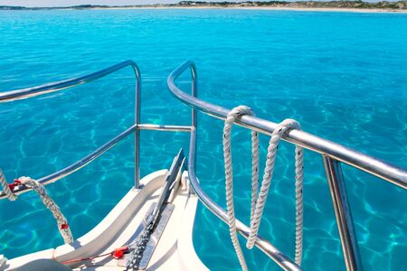 Boat in Formentera island transparent water on llevant beach